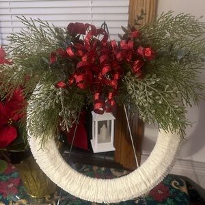Middle weight chunky yarn wreath with lantern. Much prettier on person